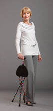 Load image into Gallery viewer, Woman using folding walking cane with seat, bubble designs
