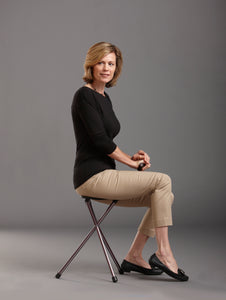 woman sitting on Folding Walking Cane with Seat, Kensington